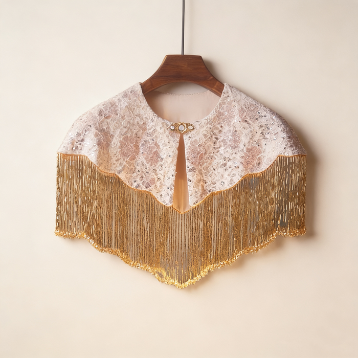 Handmade bridal shoulder cape featuring champagne gold fringe, blush embroidery, shimmering sequins, and delicate seed bead embellishments.