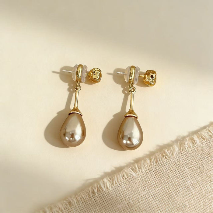 Handmade gray-purple freshwater pearl drop earrings featuring textured 14K gold-plated studs for bridal and formal occasions.