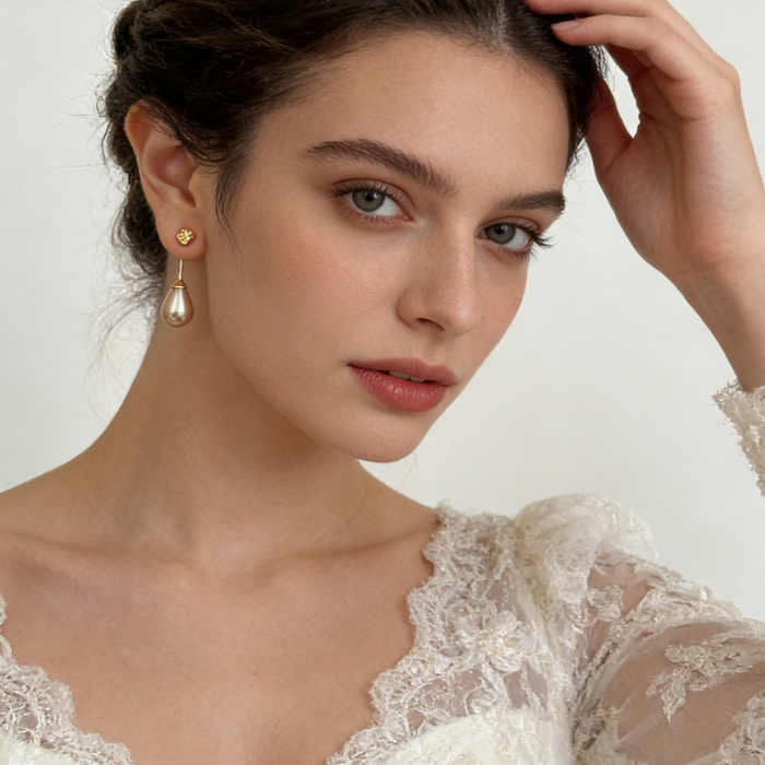Elegant bridal pearl drop earrings with genuine gray-purple freshwater teardrop pearls and organic gold-plated stud design.