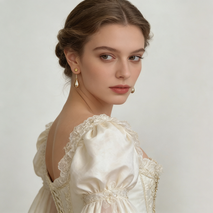Elegant bridal pearl drop earrings with genuine gray-purple freshwater teardrop pearls and organic gold-plated stud design.