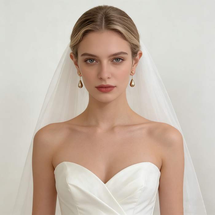 Elegant bridal pearl drop earrings with genuine gray-purple freshwater teardrop pearls and organic gold-plated stud design.