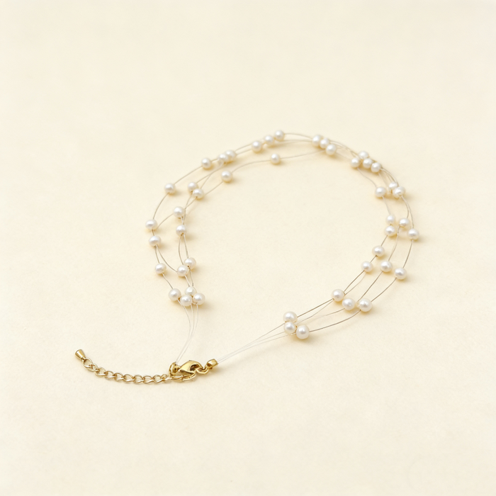 Handmade adjustable layered necklace featuring genuine freshwater pearls and 14K gold-plated hardware for elegant bridal styling.