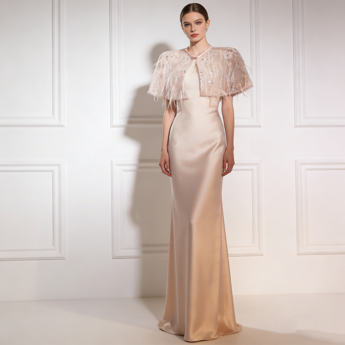 Luxury feather wedding shoulder cape with sparkling sequins and airy nude tulle for elegant bridal styling.