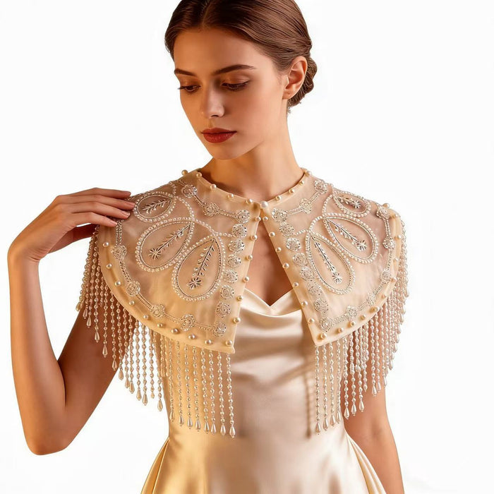 Elegant pearl embroidered bridal cape featuring delicate beaded fringe for weddings and formal occasions.