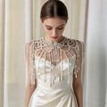 Handmade bridal shoulder necklace featuring intricate faux pearl beadwork, openwork design, and cascading pearl fringe.