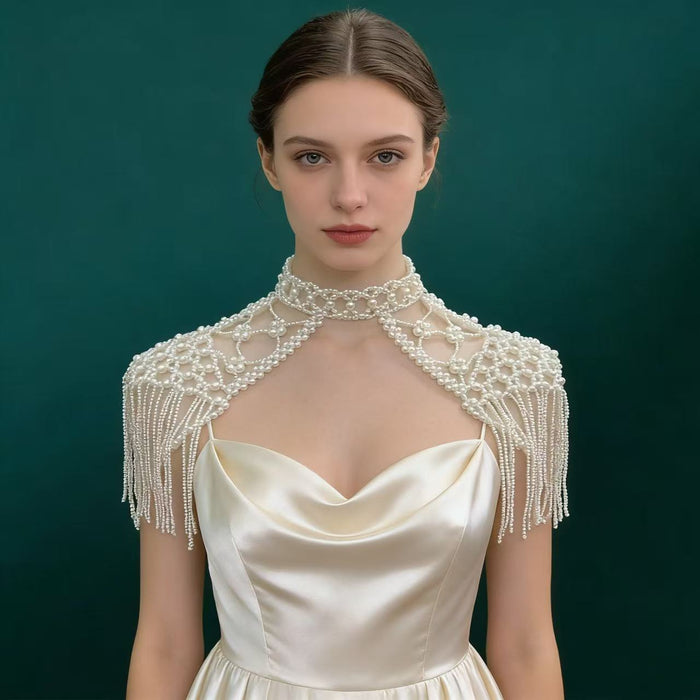 Handmade Victorian pearl fringe bridal cape with cascading faux pearl tassels for elegant wedding dress styling.