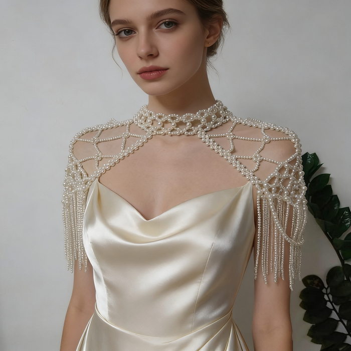 Handmade Victorian pearl fringe bridal cape with cascading faux pearl tassels for elegant wedding dress styling.