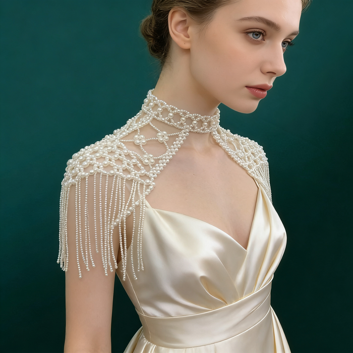 Elegant pearl shoulder wrap bridal accessory featuring layered pearl chains and vintage inspired wedding couture design.