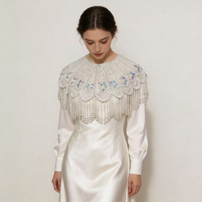 Elegant detachable bridal shoulder cape with scalloped embroidery, shimmering sequins, pearl-inspired beadwork, and luxurious pearl fringe.