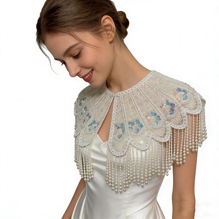 Elegant detachable bridal shoulder cape with scalloped embroidery, shimmering sequins, pearl-inspired beadwork, and luxurious pearl fringe.