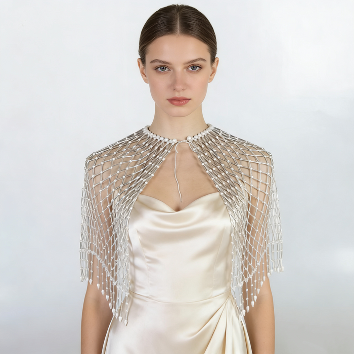 Luxury handmade bridal cape featuring pearl beads and delicate woven beadwork.