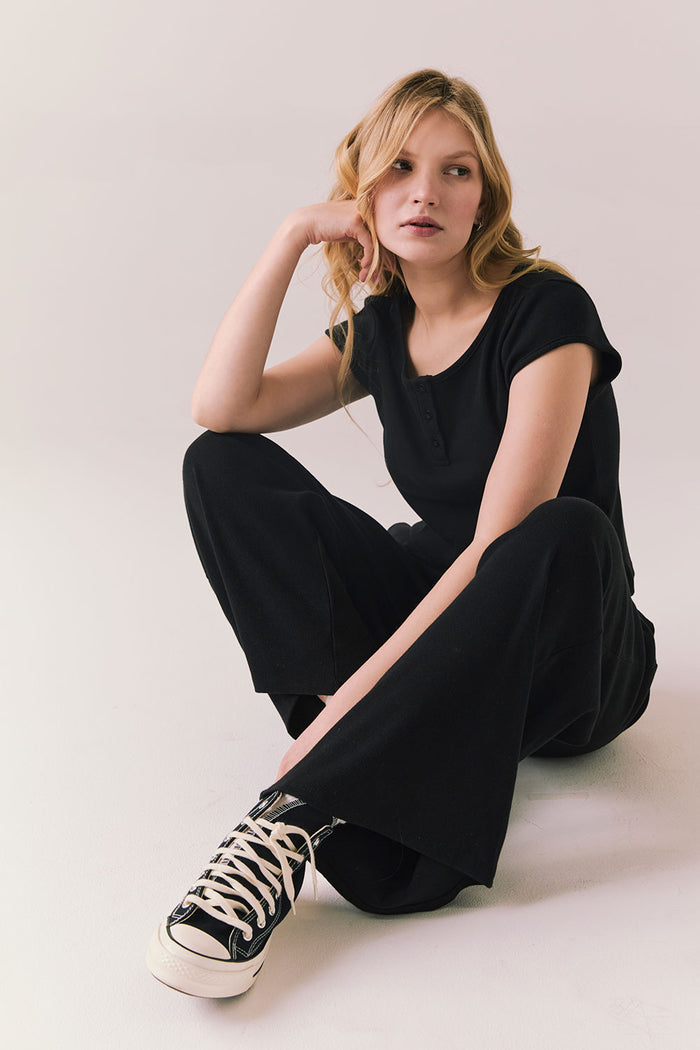 True black fleece joggers with side pockets and relaxed silhouette.