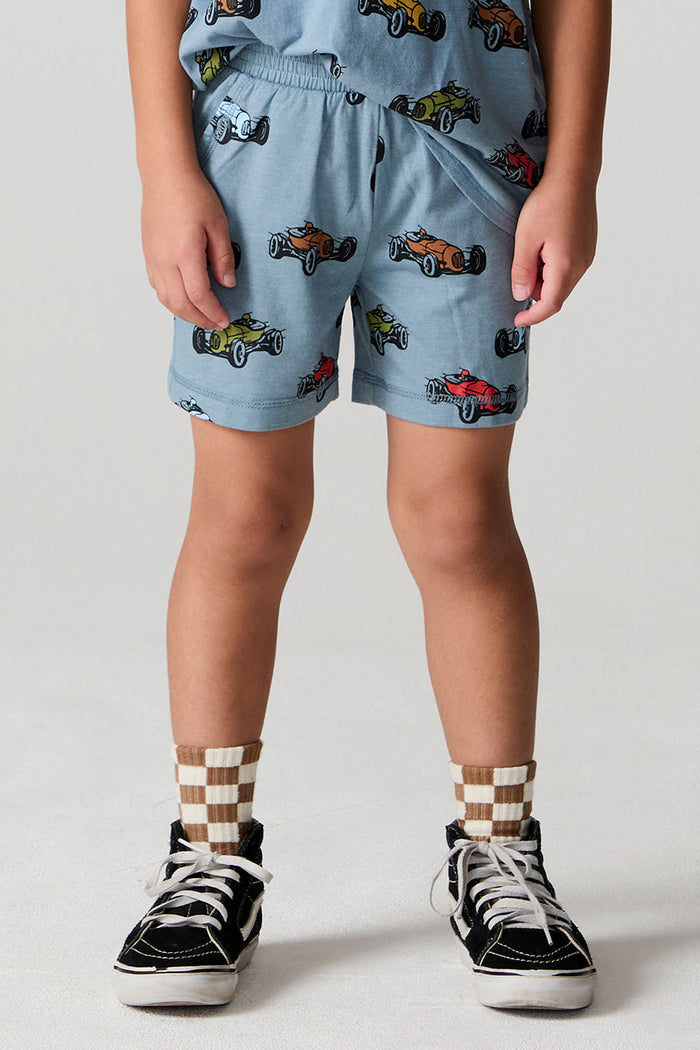Front view of a boy wearing the Chaser Have a Nice Day Shorts on a neutral background