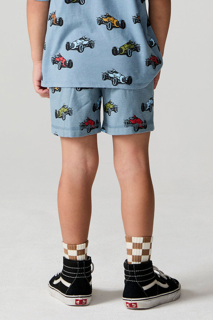 Back view of a boy wearing the Chaser Have a Nice Day Shorts on a neutral background