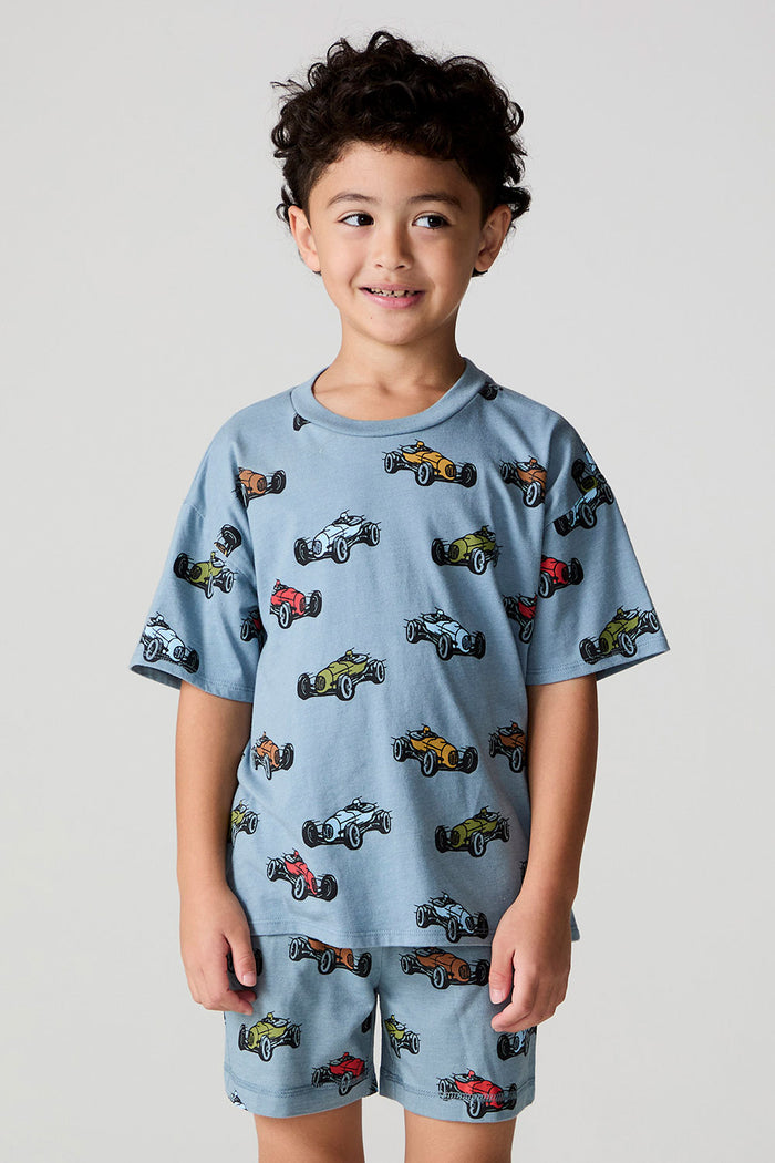 Front view of a boy wearing the Chaser Have a Nice Smile Tee on a neutral background