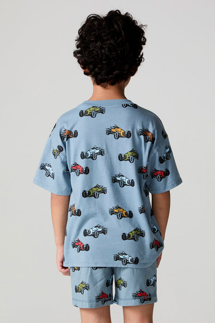 Back view of a boy wearing the Chaser Have a Nice Smile Tee on a neutral background