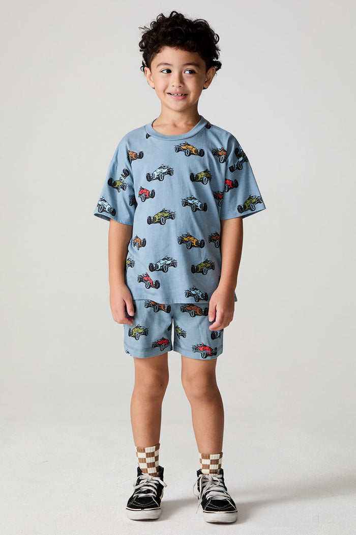 Full body front view of a boy wearing the Chaser Have a Nice Smile Tee on a neutral background