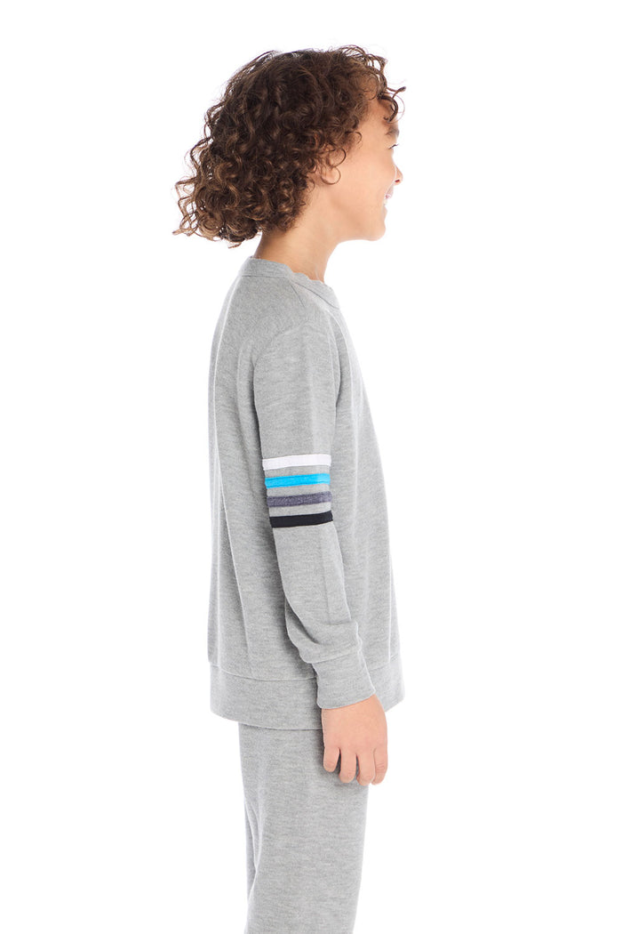 Side view of boy wearing Chaser Kids Heather Grey Long Sleeve Pullover showing sleeve stripe detail, white background