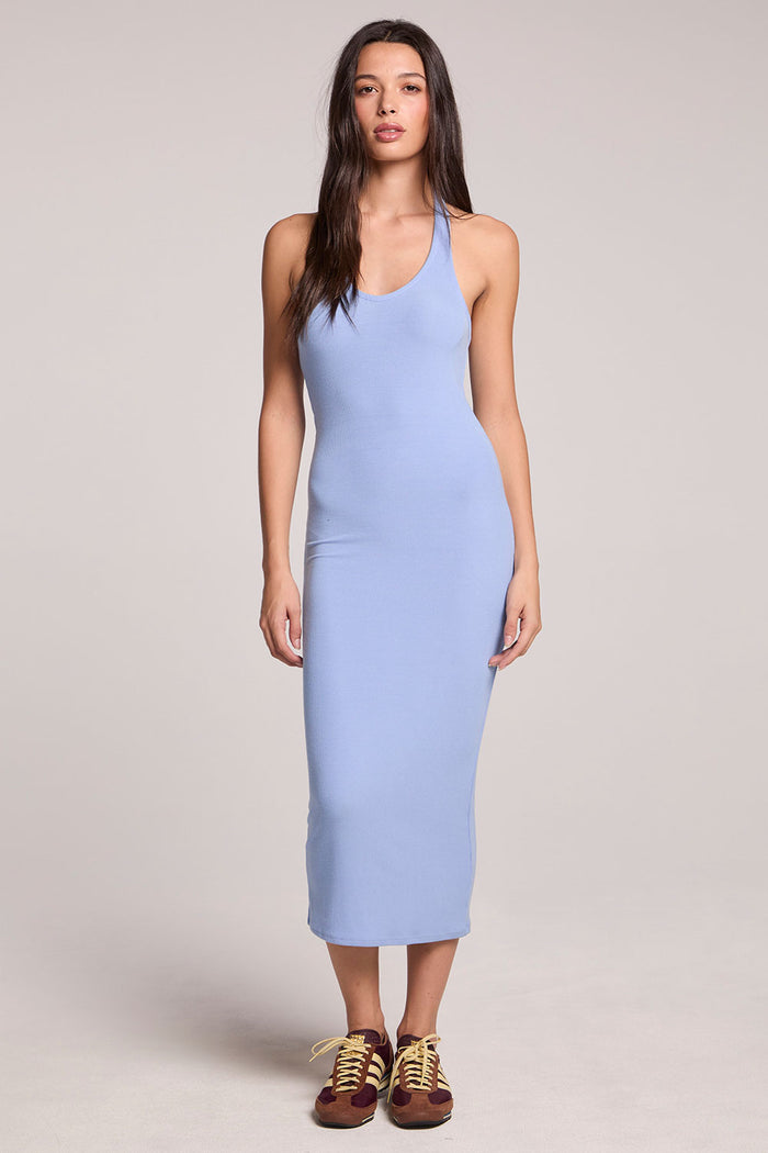Front view of a woman wearing the Chaser  Henrietta Blue Hydrangea Midi Dress and sneakers on a neutral background