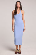 Front view of a woman wearing the Chaser  Henrietta Blue Hydrangea Midi Dress and sneakers on a neutral background