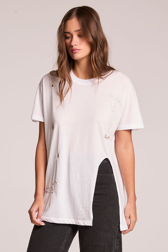 Front view of a woman wearing the Chaser  High Desert Tee on a neutral background with arms at her sides