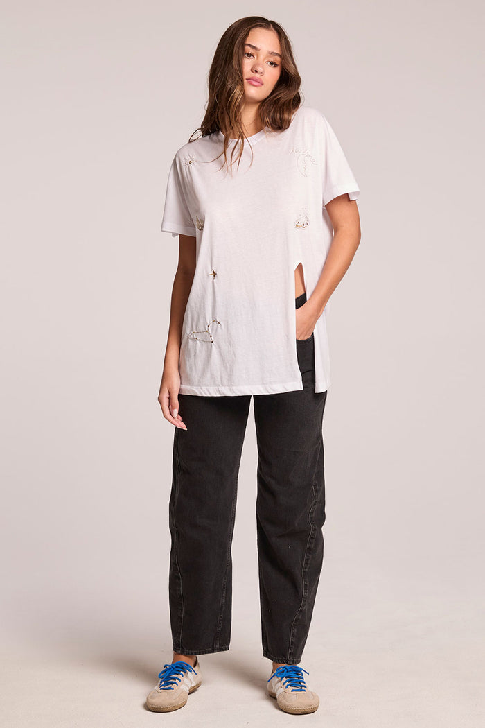 Full body front view of a woman wearing the Chaser  High Desert Tee and sneakers on a neutral background