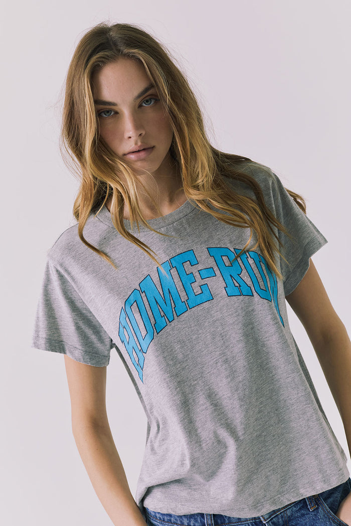 Angled front view of the Chaser Home Run Tee in Heather Grey emphasizing the relaxed shape and bold graphic placement