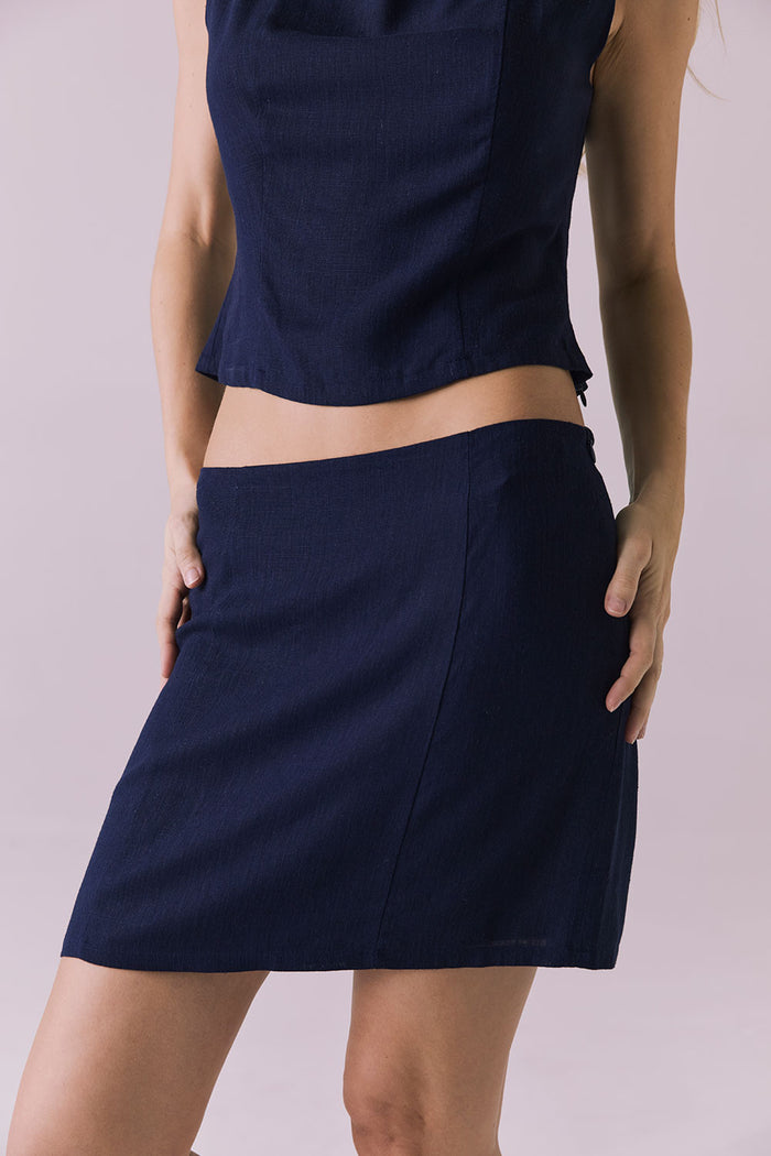 Close-up of Chaser Ibiza Navy Mini Skirt waistline and textured linen blend
