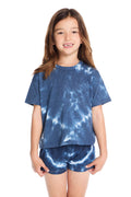 Girl wearing the Chaser Kids Indigo Heart Tie-Dye T-Shirt featuring a deep indigo hue with soft white tie-dye heart pattern and relaxed short sleeves