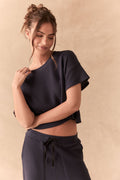 Front view of model in Irvine Tee in midnight blue with soft thermal texture and matching Billy Joggers against a beige background