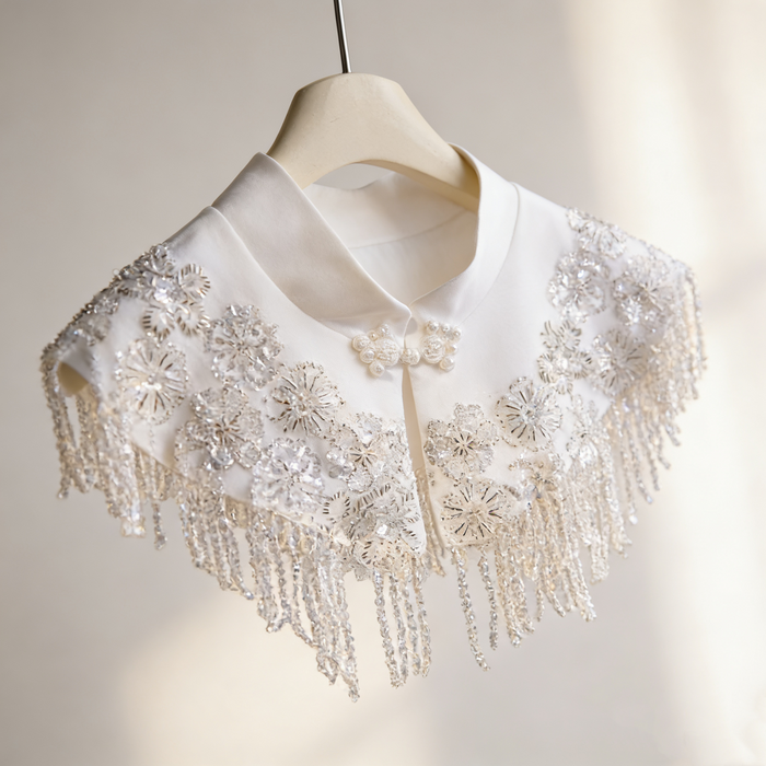 Ivory beaded bridal capelet with sequin embroidery and fringe details, luxury short wedding shawl for bridal gown.