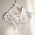 Ivory beaded bridal capelet with sequin embroidery and fringe details, luxury short wedding shawl for bridal gown.