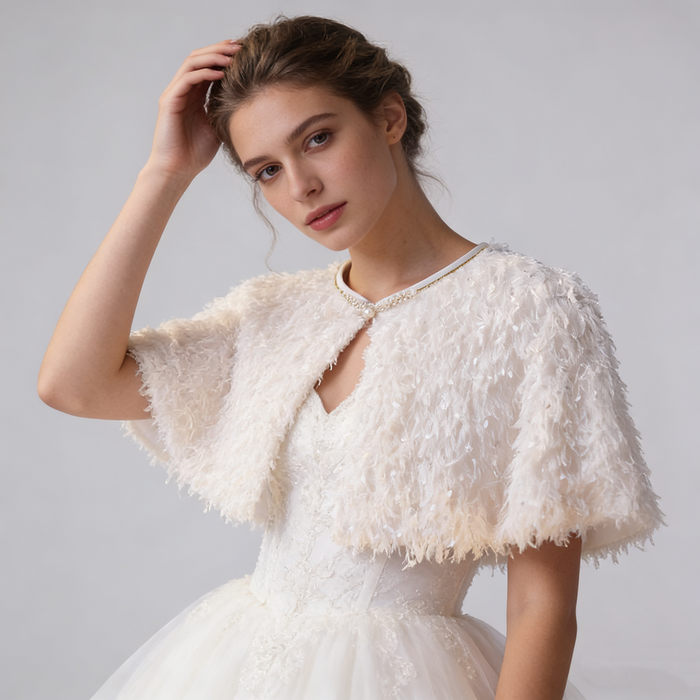 Romantic handmade feather wedding shawl with lightweight ivory feathers for bridal ceremony and reception styling.