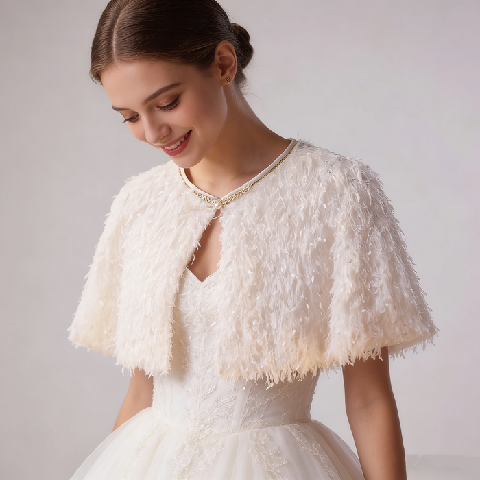 Romantic handmade feather wedding shawl with lightweight ivory feathers for bridal ceremony and reception styling.