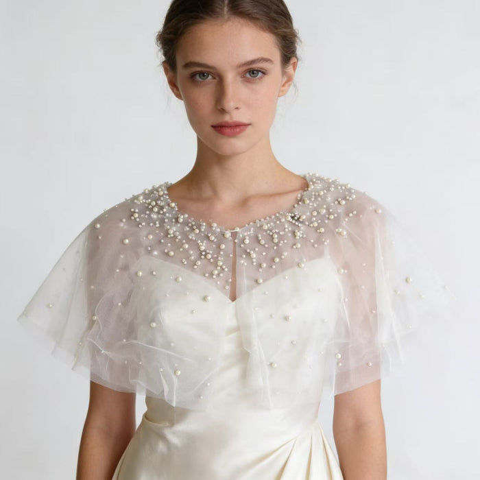 Handmade pearl embellished wedding capelet for brides, ivory chiffon bridal shawl and formal dress accessory.