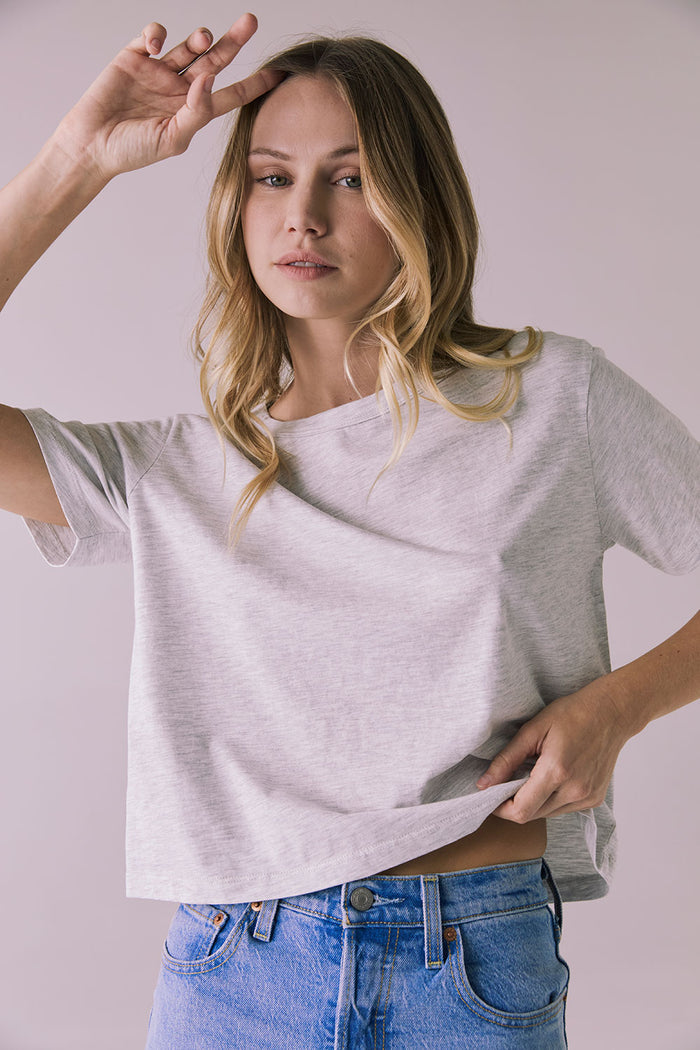 Close-up view of Chaser Brand Jameson Light Heather Grey Tee highlighting soft heather texture and smooth finish