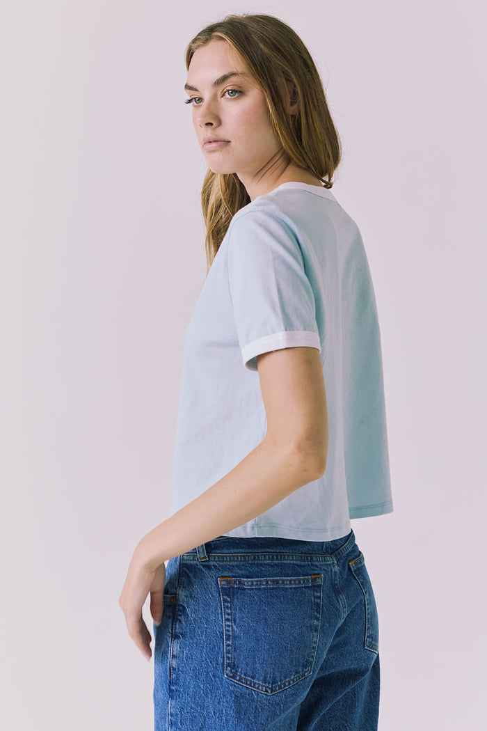 Chaser Jamesonn Tee in White and Mineral Butter shown side view with soft cropped length and subtle contrast trim