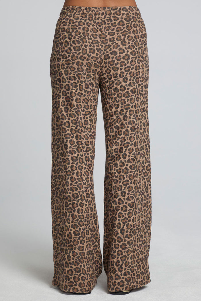 Back view of a woman wearing the Chaser  Jorgia Leopard Pant on a neutral background