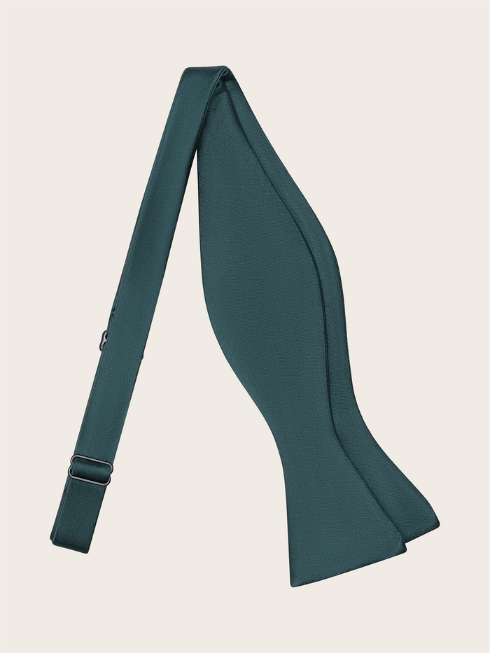 Juniper green satin bow tie, untied and draped, on a light neutral background