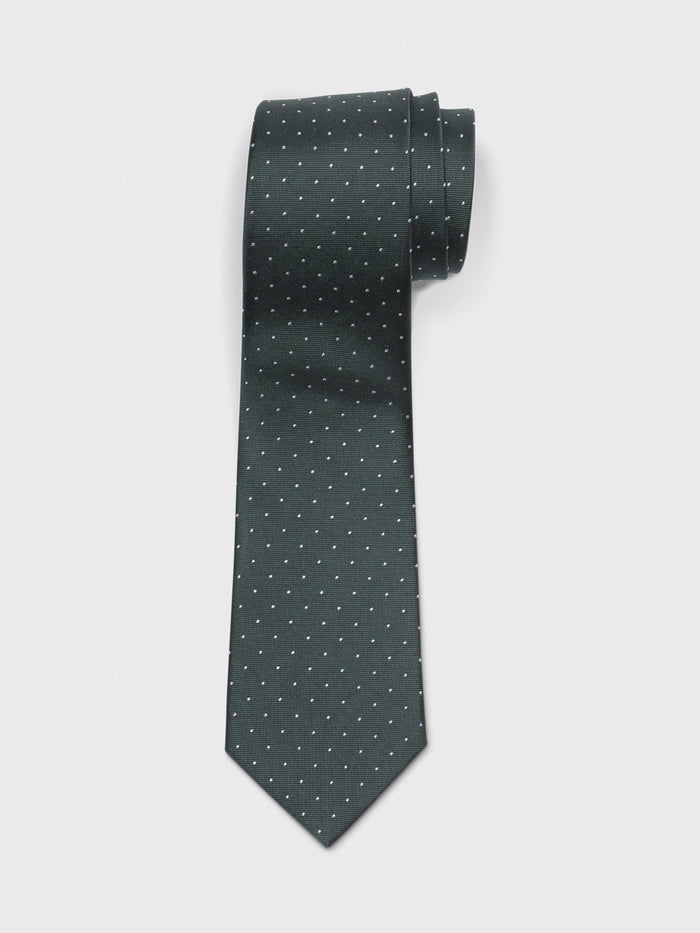 Juniper necktie with white pindots, rolled at the top on a white background.