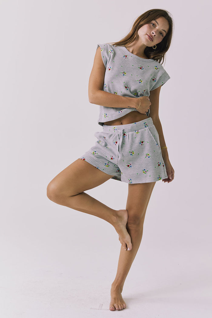 Chaser Kesh Short in Heather Grey with ditsy embroidery styled as a matching set with the Frankee Tee showcasing the coordinated waffle texture and easy lounge fit