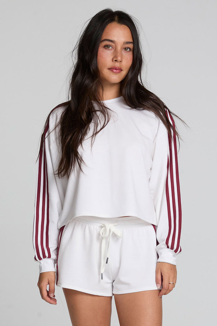 Front view of a woman wearing the Chaser Kloud Cloud White Sweatshirt Set on a neutral background with white shorts