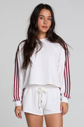 Front view of a woman wearing the Chaser Kloud Cloud White Sweatshirt Set on a neutral background with white shorts