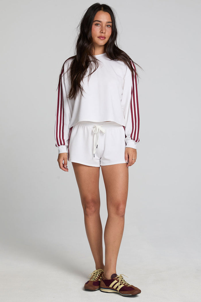 A full body front view of a woman wearing the Chaser Kloud Cloud White Sweatshirt Set on a neutral background