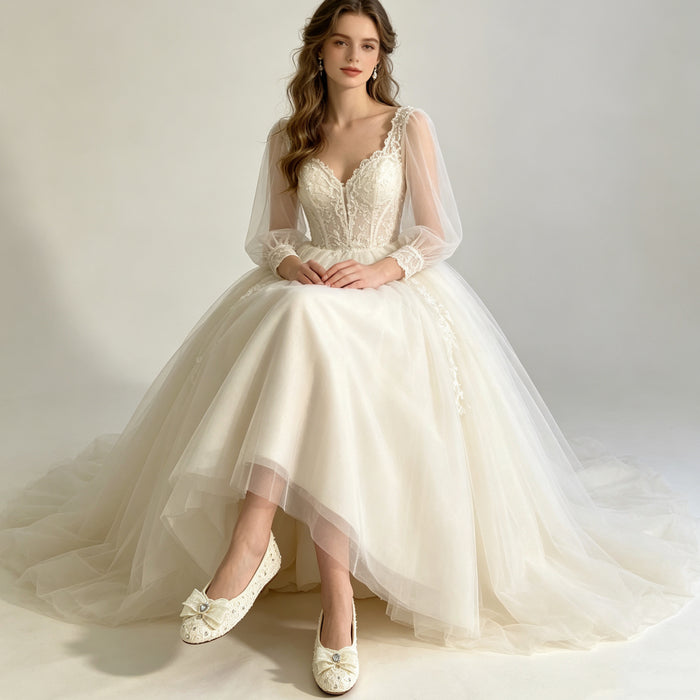 Lace bridal flats with crystal bow and rhinestone details handcrafted for elegant wedding shoes and bridal styling.