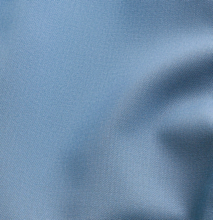Close-up of lake blue tuxedo trouser fabric with a textured weave