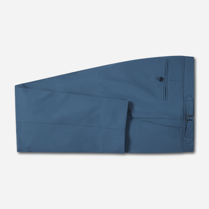 Lake blue tuxedo trousers folded flat with button and side pocket detail