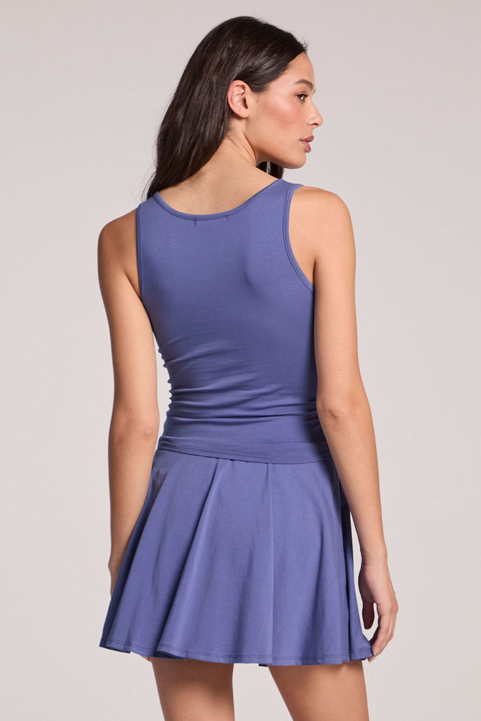 Back view of a woman wearing the Chaser French Riviera Lander Tank on a neutral background