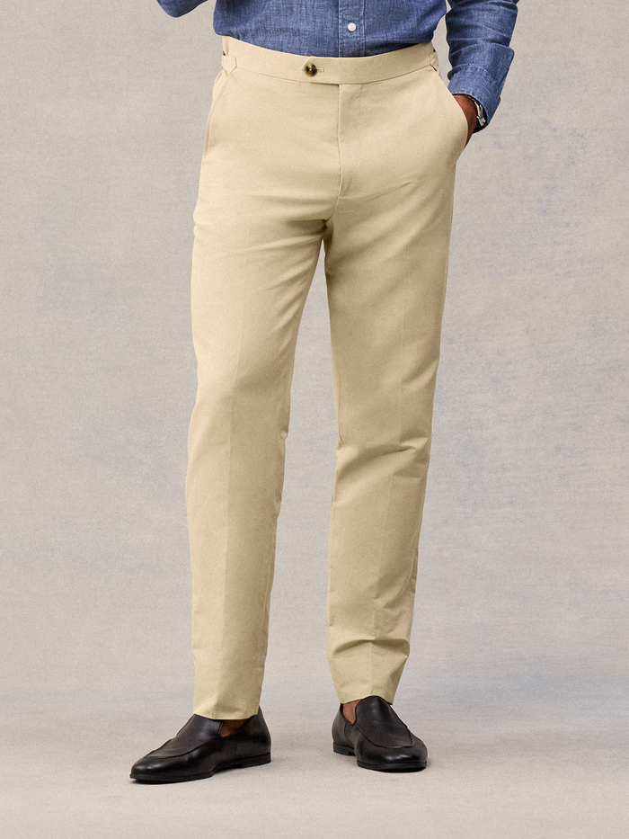 Harvest tan suit pant on model, cropped waist to hem, tab waistband and tapered leg