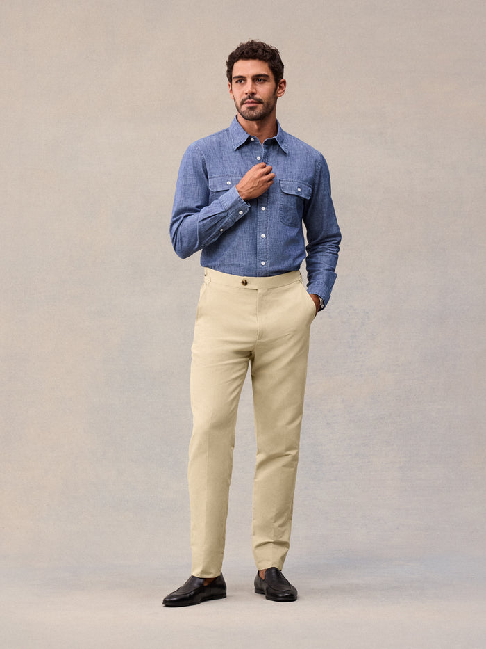 Model in harvest tan suit pant and blue chambray shirt, full-length front view